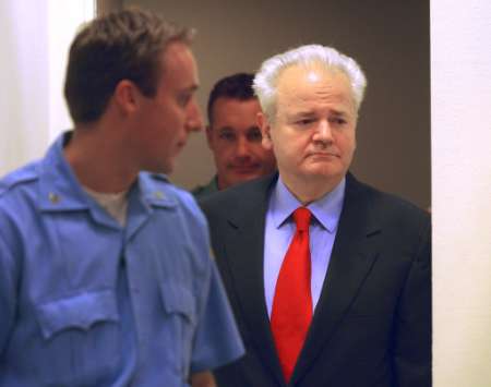 Slobodan Milosevic enters the courtroom Slobodan Milosevic enters the courtroom