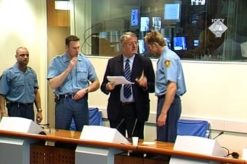 Vojislav Seselj standing in the courtroom Vojislav Seselj standing in the courtroom