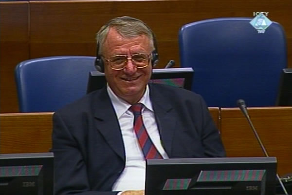 Vojislav Seselj listening to the first prosecution witness